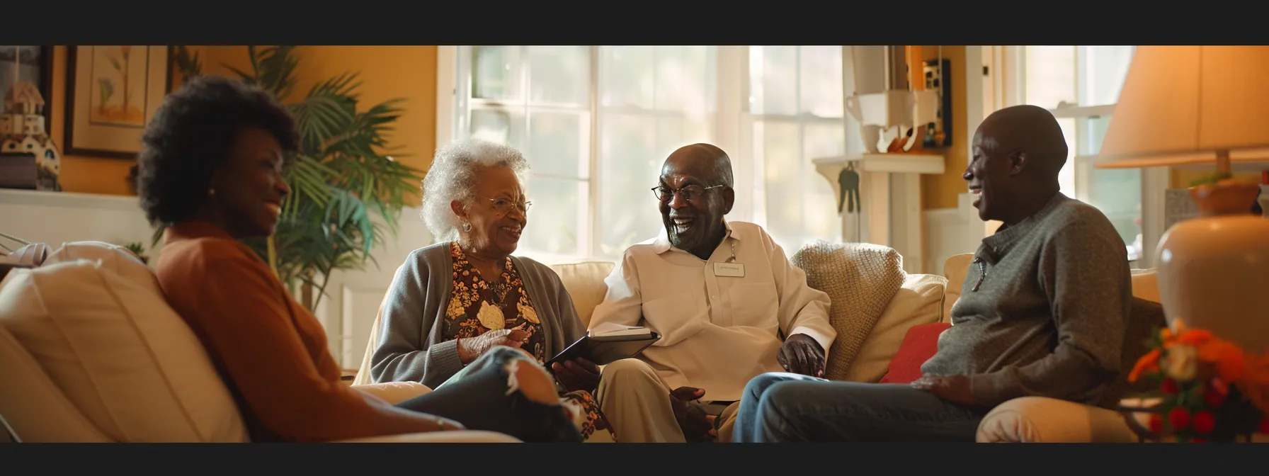 a diverse group of older adults interacts warmly with compassionate caregivers in a cozy living room setting in cobb county, showcasing supportive interactions that emphasize independence and mobility assistance amid subtly elegant southern architecture.